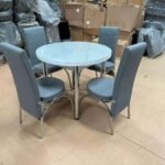 GREY AND WHITE ROUND TABLE WITH FULL GREY CHAIRS