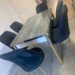 GREY WOODEN EFFECT TABLE WITH BLACK STAR FABRIC CHAIR WITH GOLD LEG